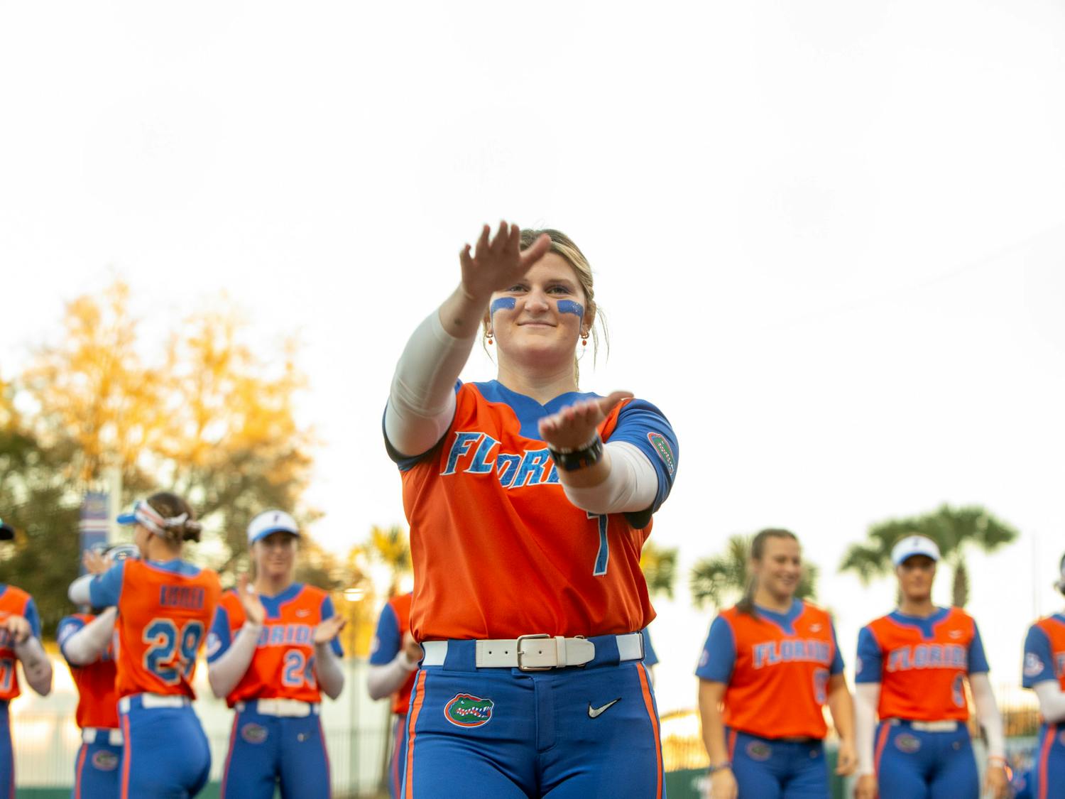 Gators softball pitcher Keagan Rothrock does the Gator chomp before the team's game against Oklahoma State on Monday, February 19, 2024.