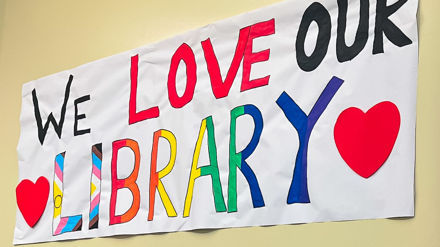 The reopened Pride Center Library was decorated with rainbows and signs, including one banner that read "We Love Our Library" on Saturday, Feb. 15, 2025.
