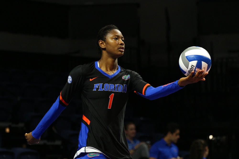 UF middle blocker Rhamat Alhassan holds the ball during Florida's 3-0 win against Florida A&amp;M on Friday at the O'Connell Center.