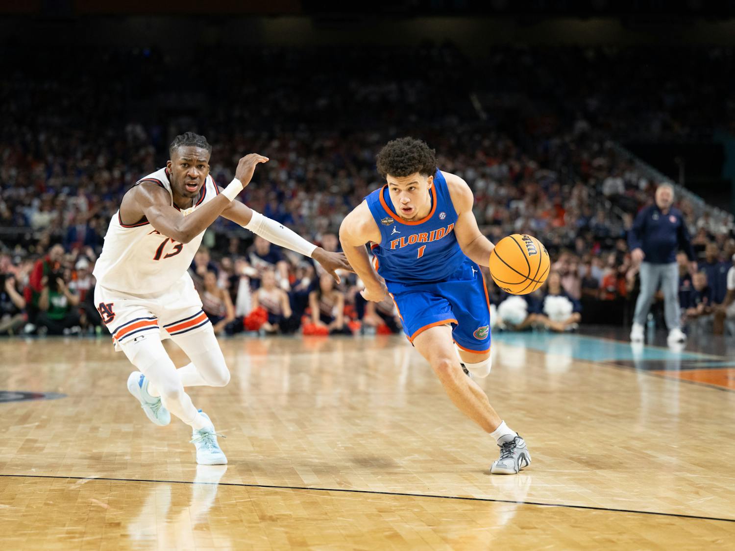 Florida Gators guard Walter Clayton Jr. (1) drives with the ball during a basketball game against the Auburn Tigers in the Final Four round of the NCAA Tournament on Saturday, April 5, 2025, in San Antonio, Texas.