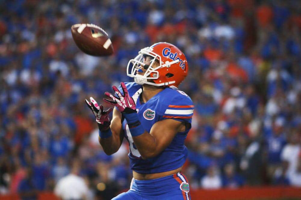 <p>Trey Burton reaches to catch a punt during Florida’s 30-10 victory against Arkansas on Oct. 5 in Ben Hill Griffin Stadium. Burton finished the season with one touchdown.</p>