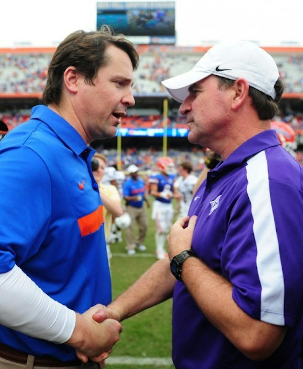 <p>Florida coach Will Muschamp (left) said Furman coach Bruce Fowler (right) deserved credit for confusing the Gators’ defense in Saturday’s 54-32 win.</p>