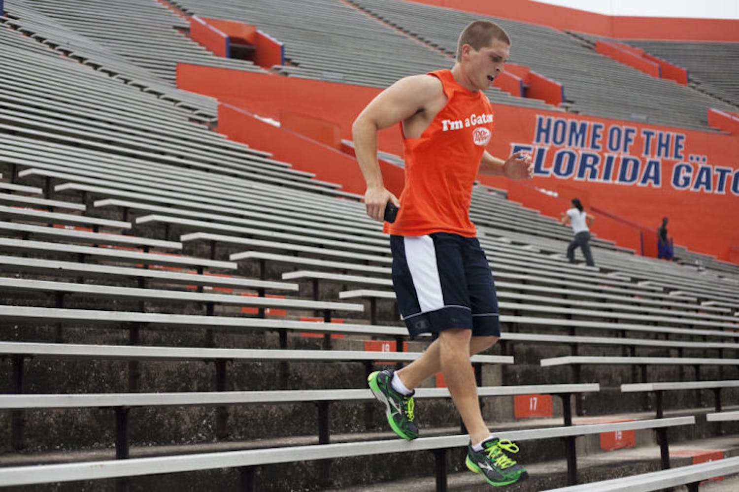UF engineering freshman Joe Liccini, 19, exercises at Ben Hill Griffin Stadium on Monday. According to a study, walking can lower people’s risk of high blood pressure as much as running can.