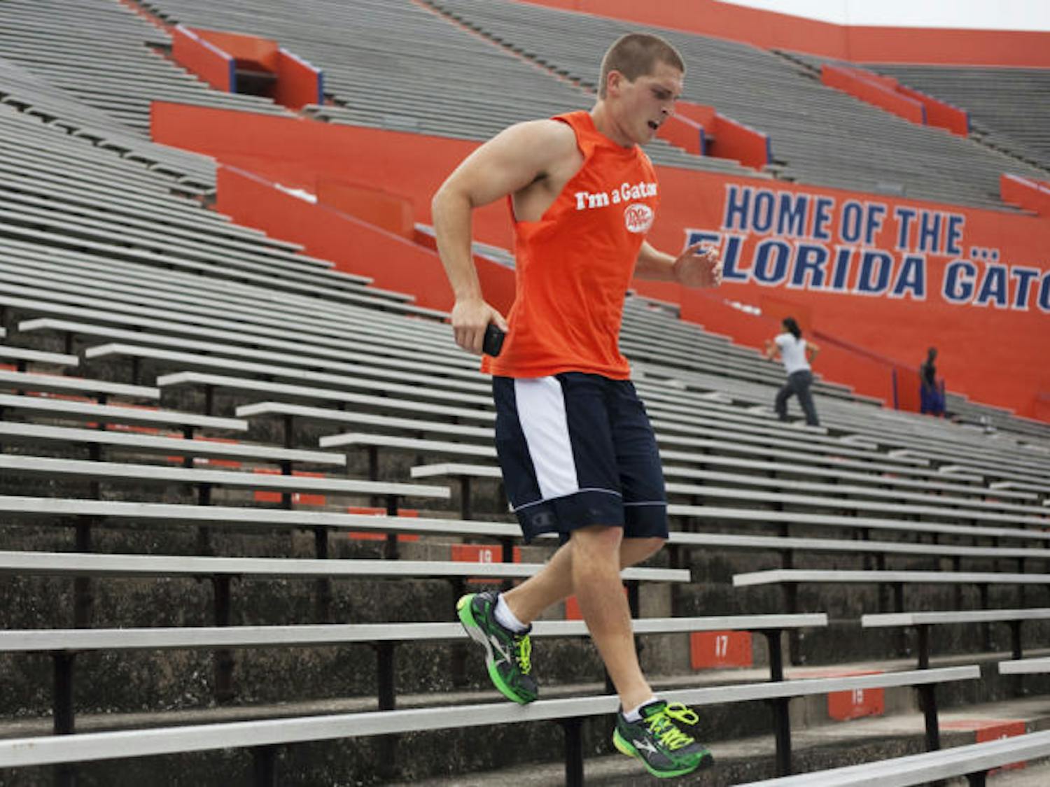 UF engineering freshman Joe Liccini, 19, exercises at Ben Hill Griffin Stadium on Monday. According to a study, walking can lower people’s risk of high blood pressure as much as running can.