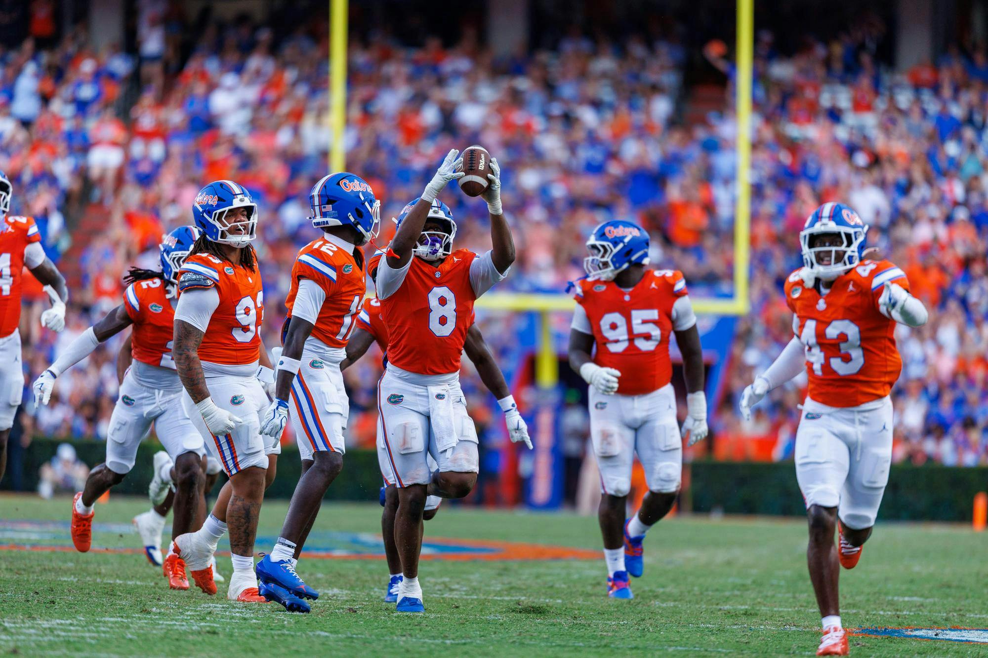 Florida inside linebacker Aaron Chiles (8) celebrates by holding the ball in the air during the first half of an NCAA football game against Campbell, Saturday, Sept. 12, 2026, in Gainesville, Fla.