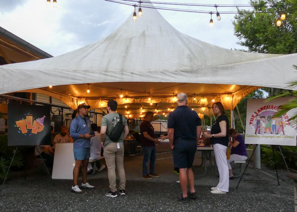 The Language Party gathers outside Boxcar Beer & Wine Garden at Depot Park on July 3, 2025.