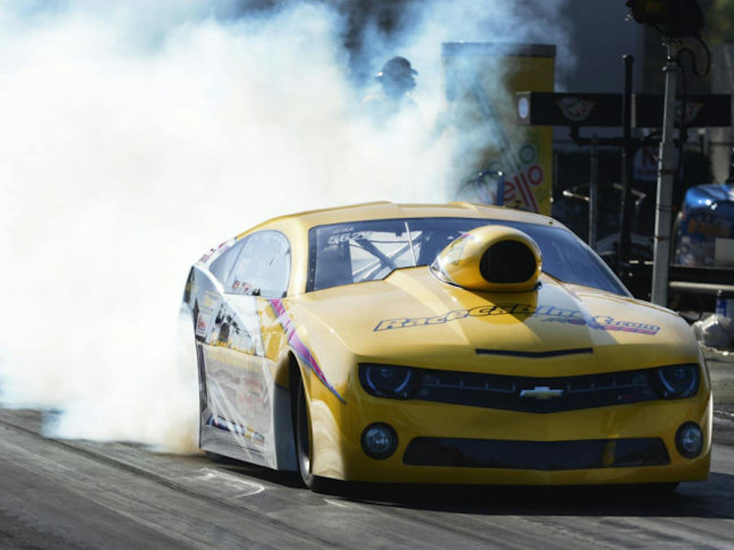Racecabinet.com driver Jim Greenheck performs a burnout during the 44th annual NHRA Gatornationals at Auto Plus Raceway Gainesville on Saturday.