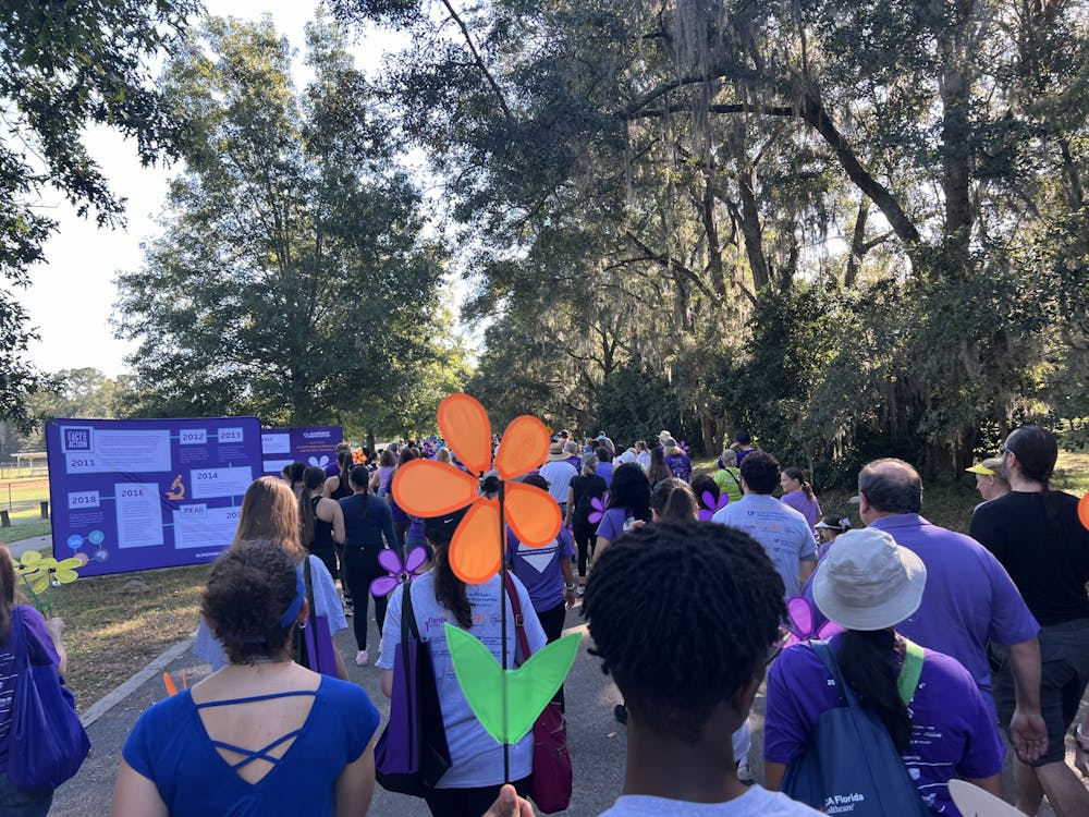 <p>Attendees walk during the Walk to End Alzheimer’s on Saturday, Oct. 26, 2024. </p>