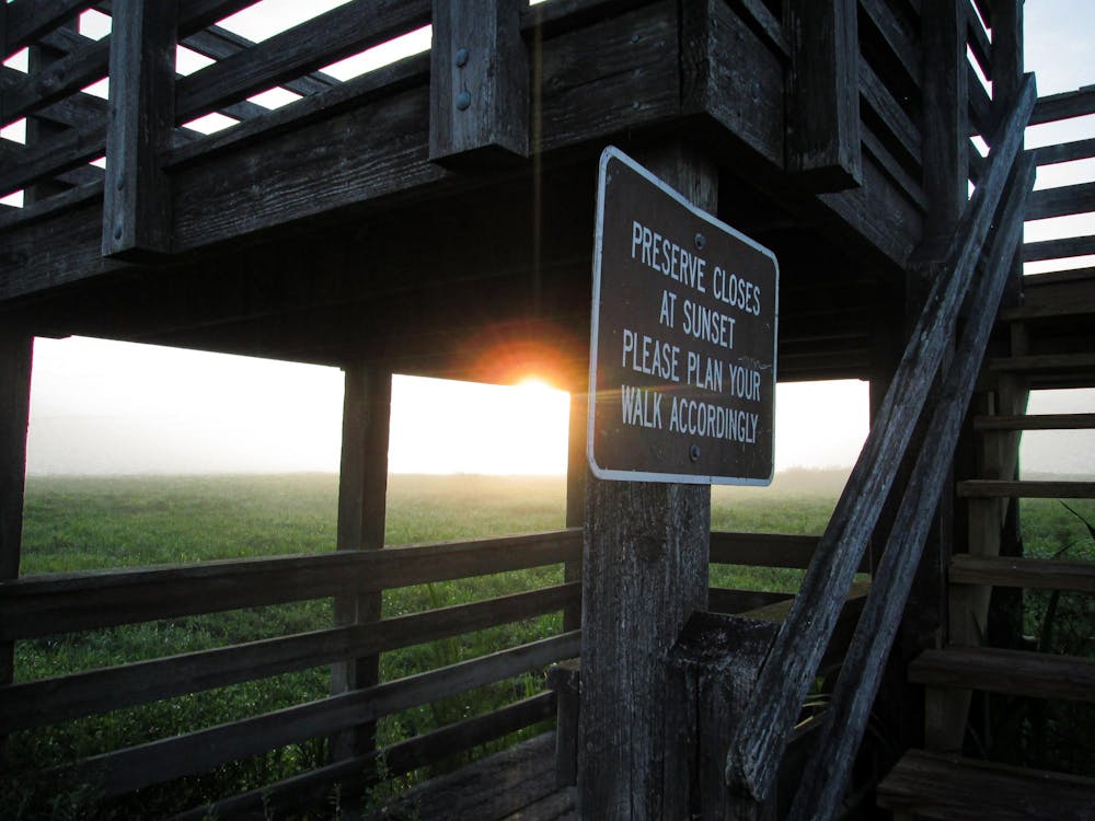 A sign at the lookout on the Bolen Bluff trail at Payne’s Prairie warns guests about preserve hours on Saturday, June 14, 2025.