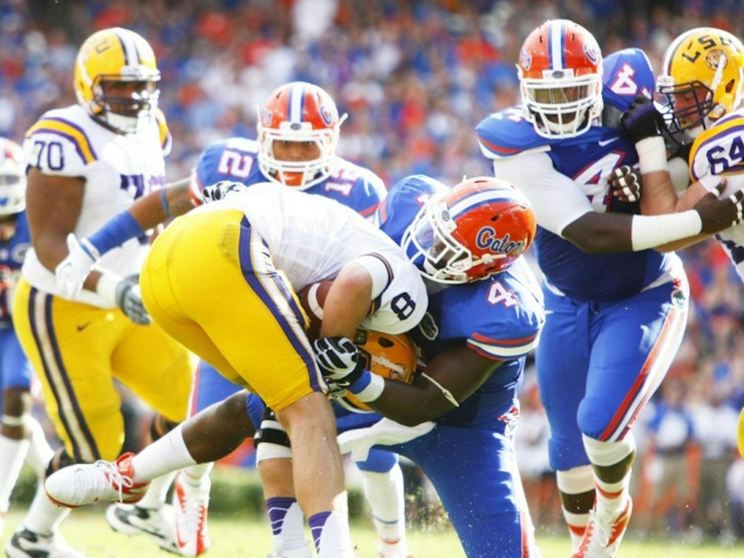 Junior Damien Jacobs (4) sacks LSU quarterback Zach Mettenberger (8) in the second quarter of Florida's 14-6 victory on Saturday in Ben Hill Griffin Stadium. The Gators had a season-high four sacks in the win.