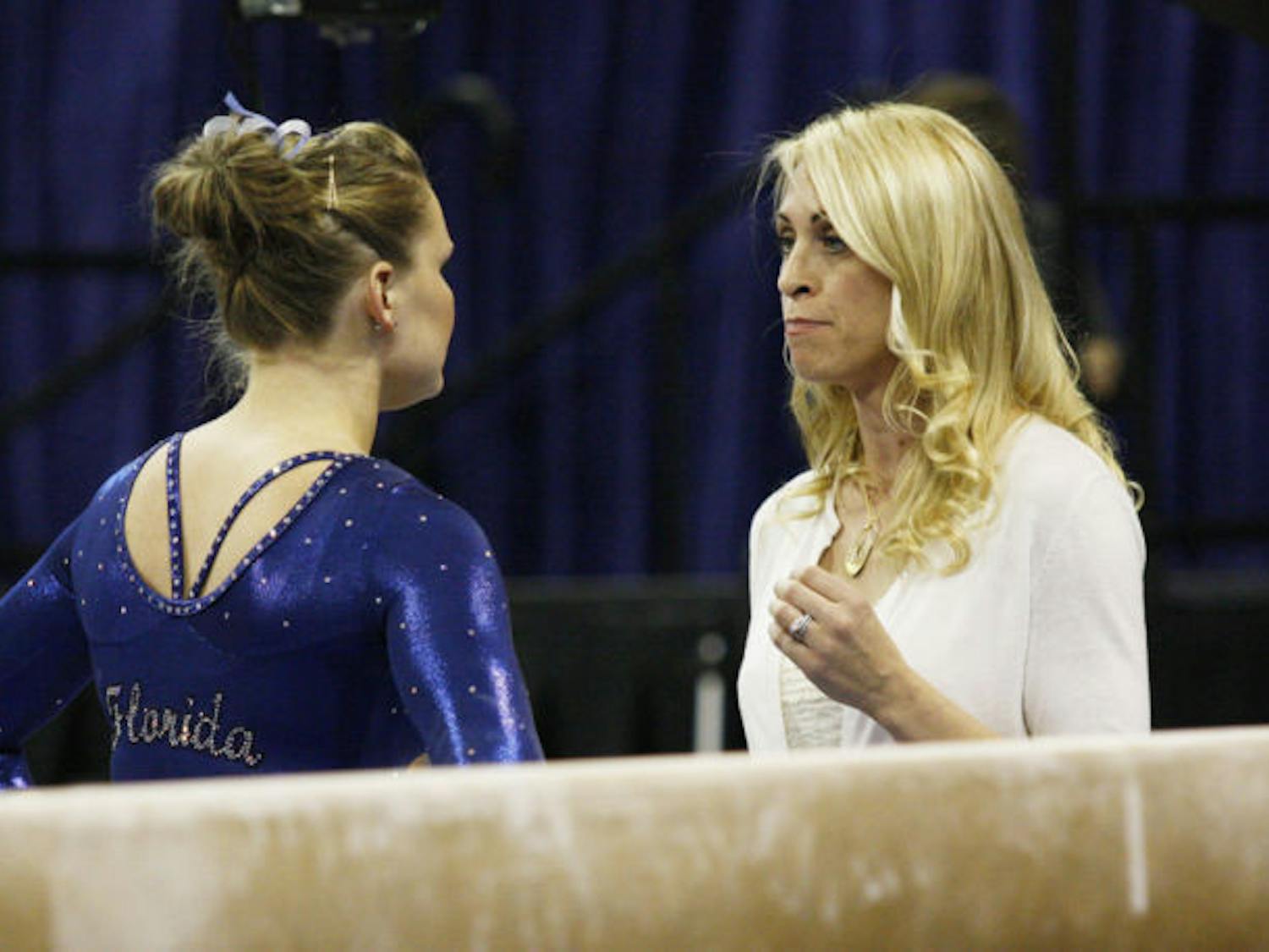 Coach Rhonda Faehn talks to freshman Bridget Sloan before her performance on beam during Florida’s 197.3-194.625 victory against Missouri on Jan. 18 in the O’Connell Center.