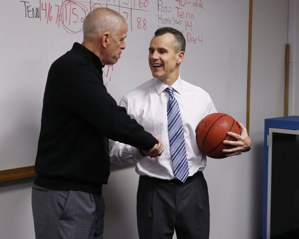 Jeremy Foley shakes hands with Billy Donovan during the Gators' game against the Tennessee Volunteers on Saturday, February 28, 2015, at the Stephen C. O'Connell Center in Gainesville, FL / UAA Communications photo by Tim Casey