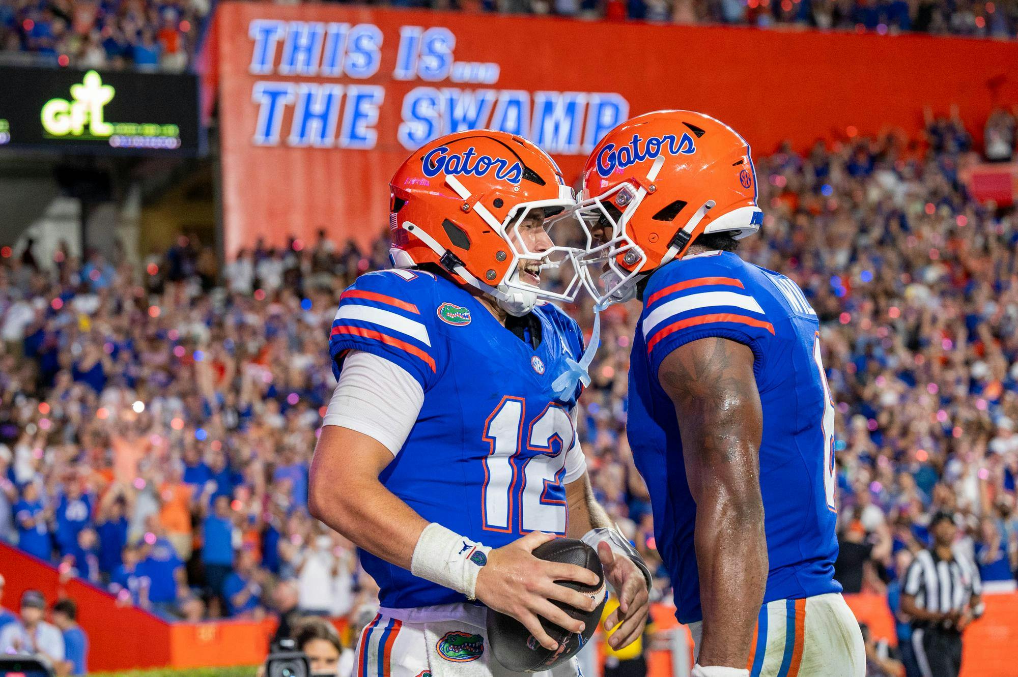 Florida quarterback Aaron Philo (12) celebrates after making a touchdown during the first half of an NCAA college football game against FAU, Saturday, Sept. 5, 2026, in Gainesville, Fla.