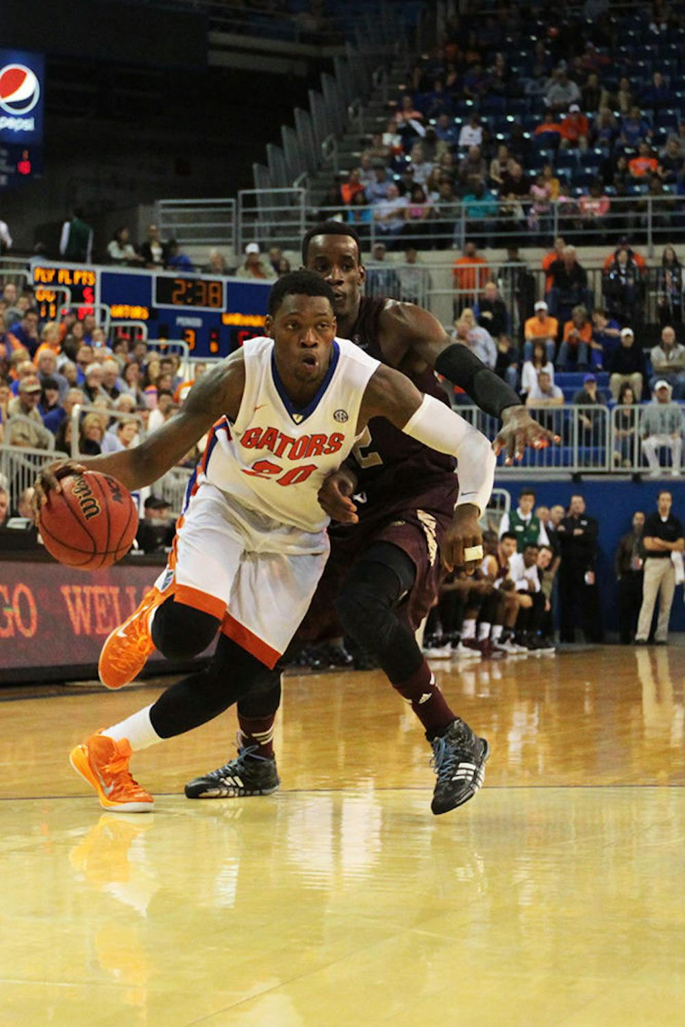 <p>Junior shooting guard Michael Frazier II drives into the paint during Florida's 61-56 win against Louisiana-Monroe in the O'Connell Center.</p>