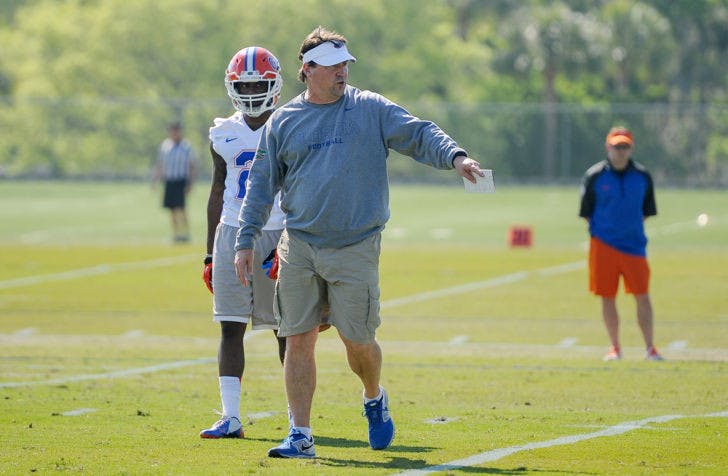 Will Muschamp instructs players during Florida’s first open practice on March 19 at Sanders Practice Fields.