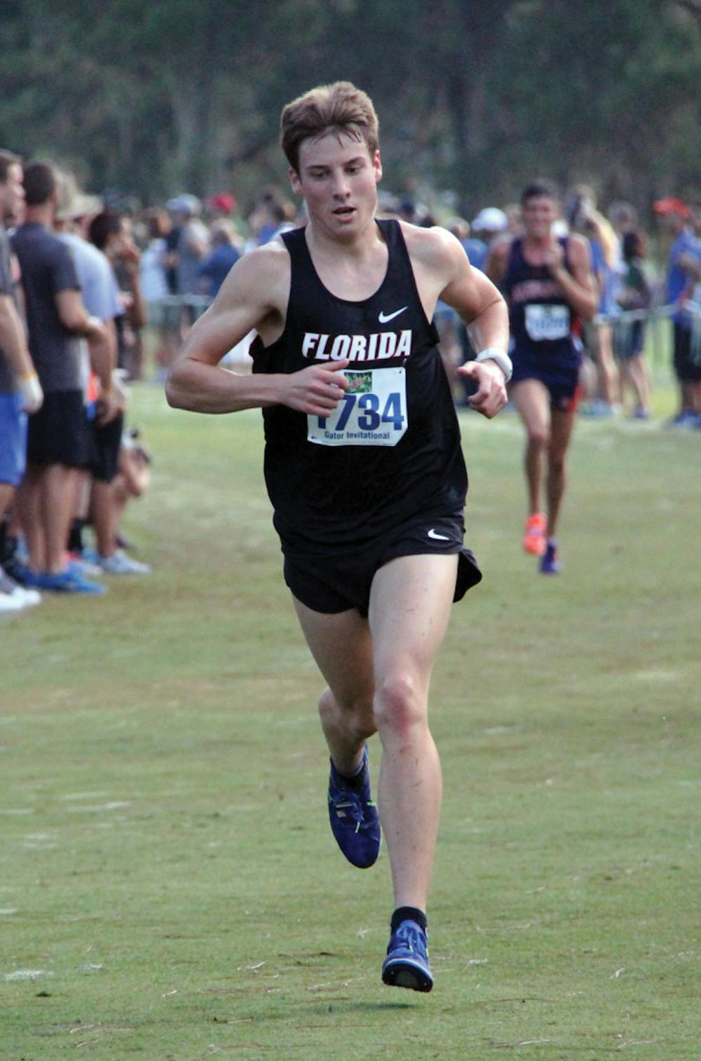 <p>Jimmy Clark runs at the Mountain Dew Invitational on Saturday in Gainesville. Clark won his race in 23:53.78.</p>
