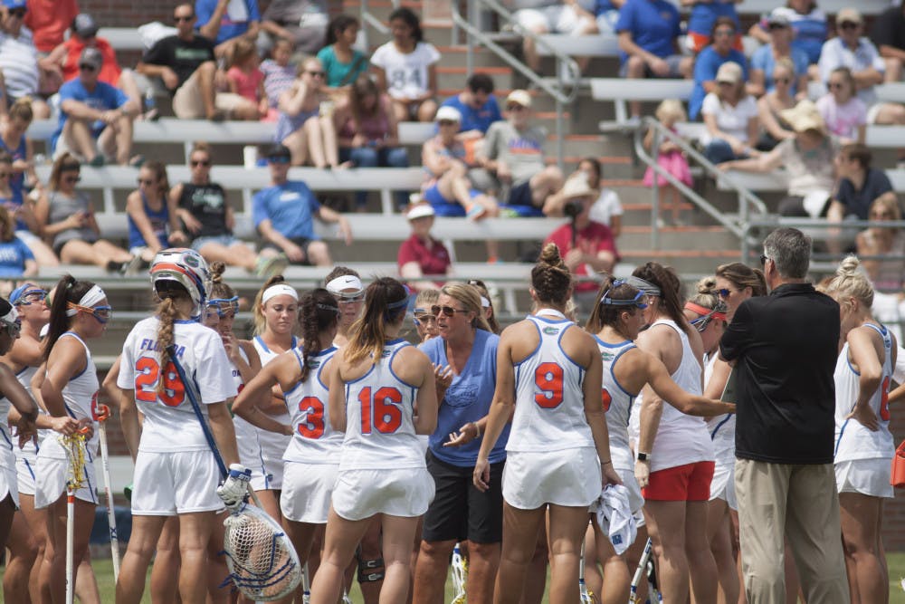 Coach Amanda O'Leary (center) was impressed with her freshmen in the Gators' season-opening game against Colorado. “It was exciting to see them get on the board early,” she said. 
