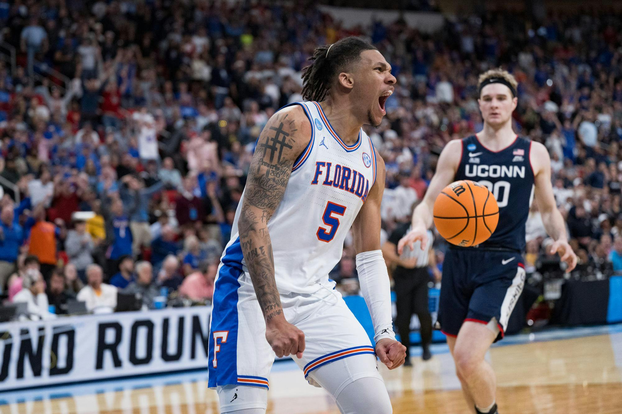 Florida Gators guard Will Richard (5) celebrates after a dunk during a basketball game against UConn in the second round of the NCAA Tournament on Sunday, March 23, 2025, in Raleigh, N.C.