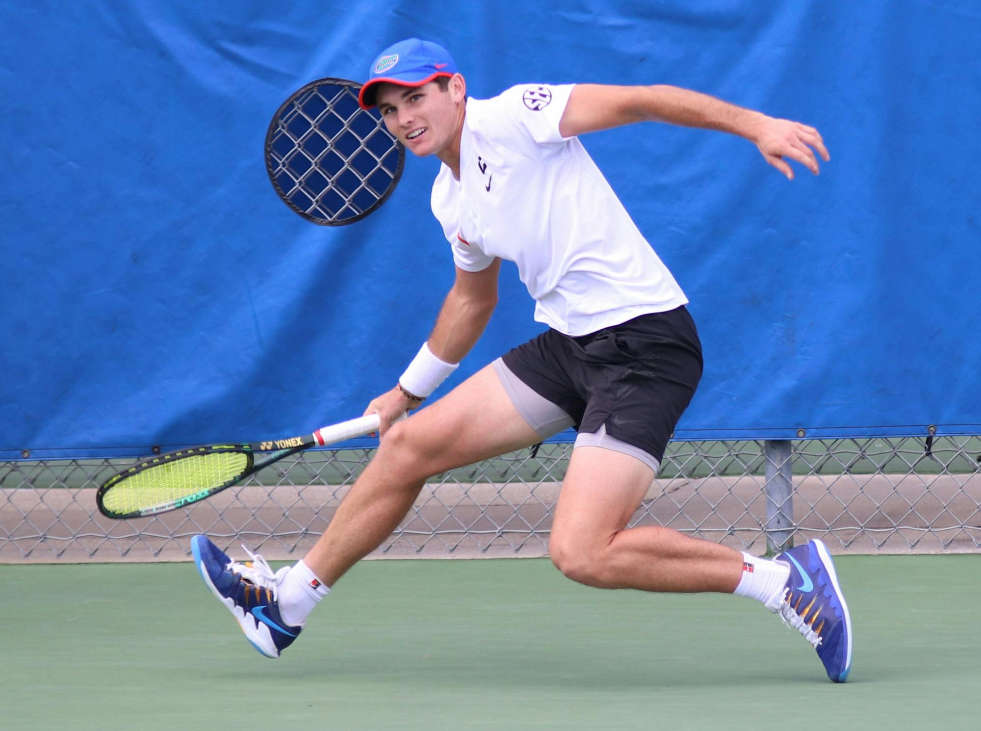 Gators men’s tennis will head westward to continue a three-game win streak. Photo from UF-Auburn match Feb. 21.