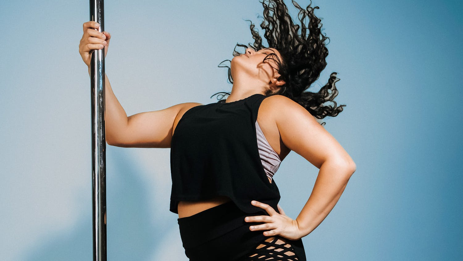 Owner of Happy Kiss Pole Dancing, Johanna Monserratte, poses for a portrait.