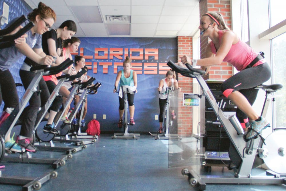 Alyssa Vocelka, a 21-year-old UF accounting senior, leads her Cycle fitness class at the Student Recreation and Fitness Center. Vocelka had Labor Day weekend off and spent it fishing in her hometown of Stuart, Florida. “I caught a giant Snook on the beach,” she said.