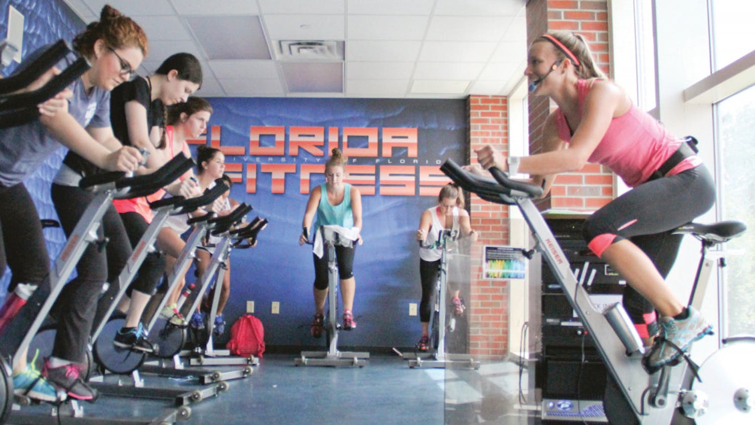 Alyssa Vocelka, a 21-year-old UF accounting senior, leads her Cycle fitness class at the Student Recreation and Fitness Center. Vocelka had Labor Day weekend off and spent it fishing in her hometown of Stuart, Florida. “I caught a giant Snook on the beach,” she said.