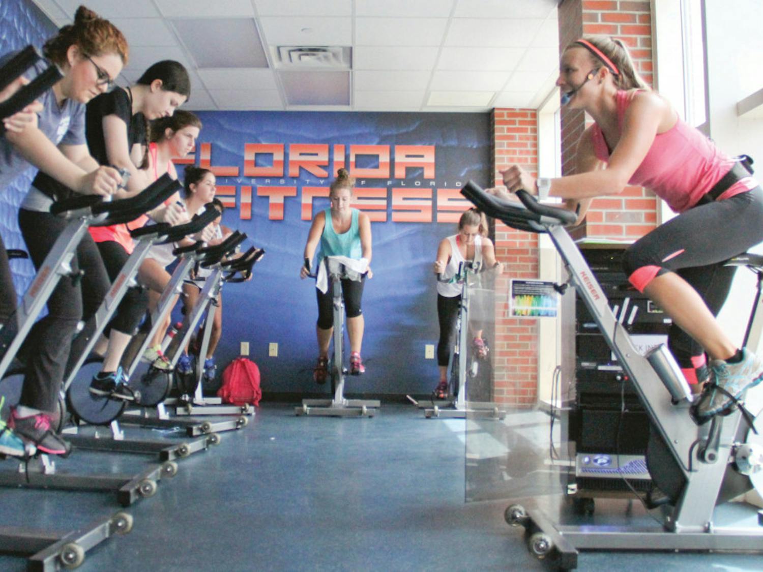 Alyssa Vocelka, a 21-year-old UF accounting senior, leads her Cycle fitness class at the Student Recreation and Fitness Center. Vocelka had Labor Day weekend off and spent it fishing in her hometown of Stuart, Florida. “I caught a giant Snook on the beach,” she said.