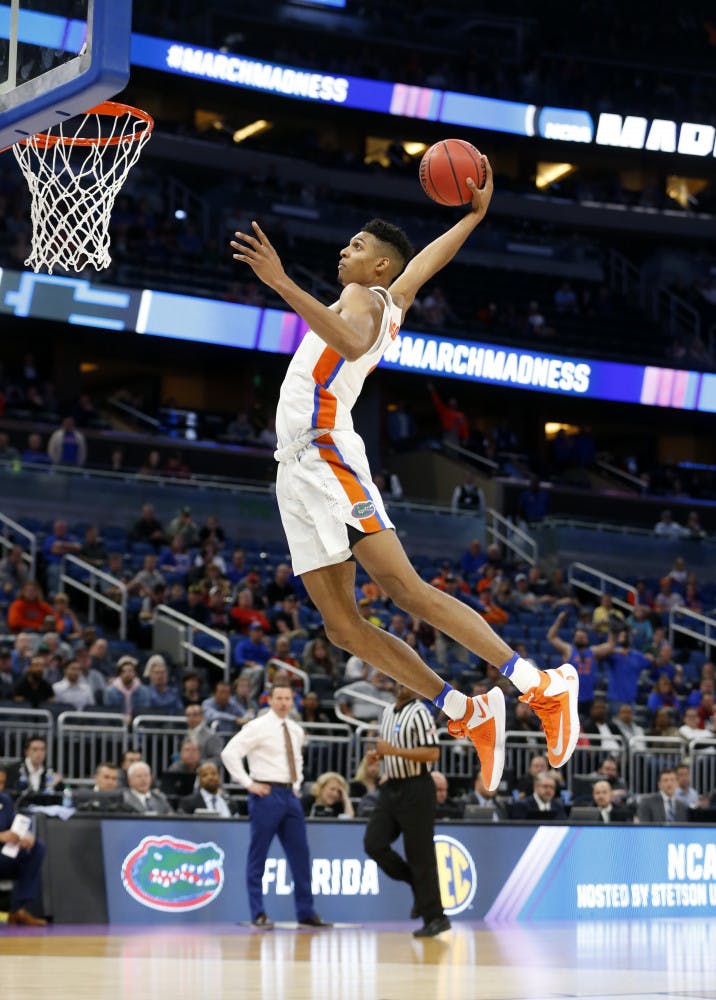 Florida forward Devin Robinson dunks the ball during the second half of the first round of the NCAA college basketball tournament against East Tennessee State, Thursday, March 16, 2017 in Orlando, Fla. Florida defeated ETSU 80-65. (AP Photo/Wilfredo Lee)