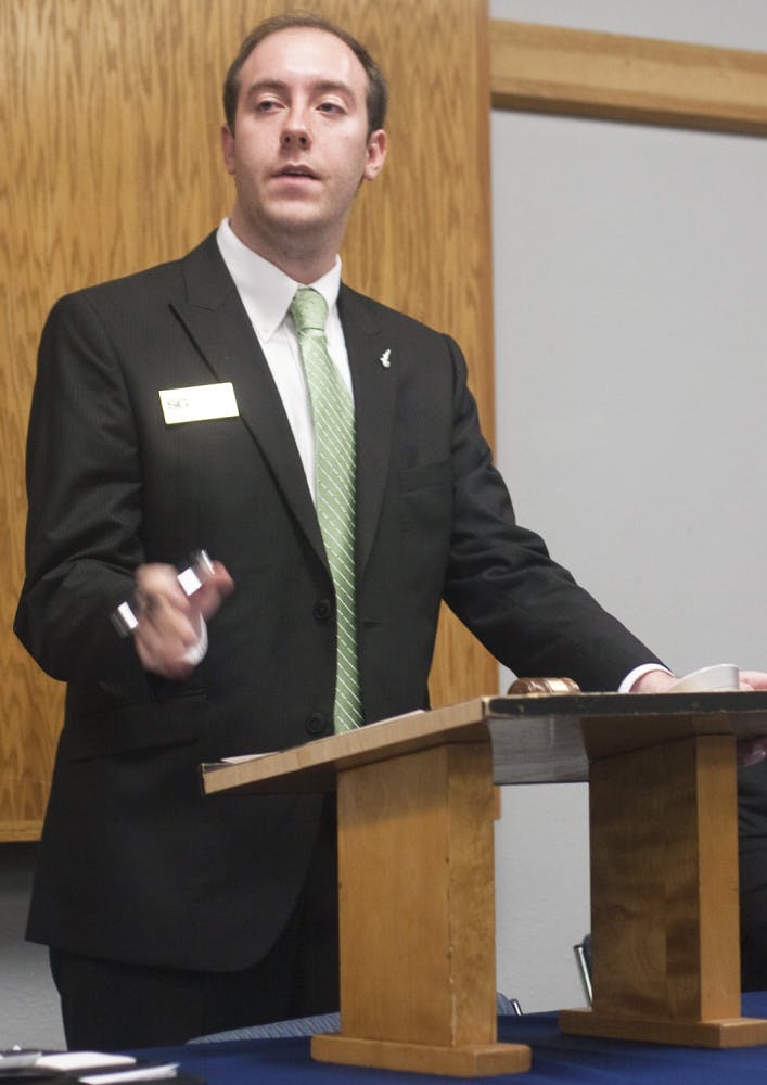Student Senate President Logan Harrison presides over the Student Senate meeting Tuesday night in the Reitz Union.