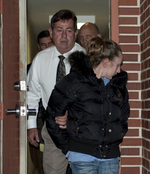 Maranda J. Martin, 22, walks out of the GPD Criminal Investigations Bureau at 211 NE First Street after her arrest on a charge of attempted murder and home invasion robbery with a firearm. Martin turned herself in to Gainesville Police with her mother at about 10 a.m. Tuesday.