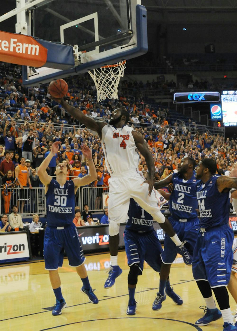 <p align="justify">Patric Young attempts a layup against Middle Tennessee on Nov. 21, 2013, in the O’Connell Center. Young is averaging 10.8 points per game and 5.9 rebounds per game this season.</p>