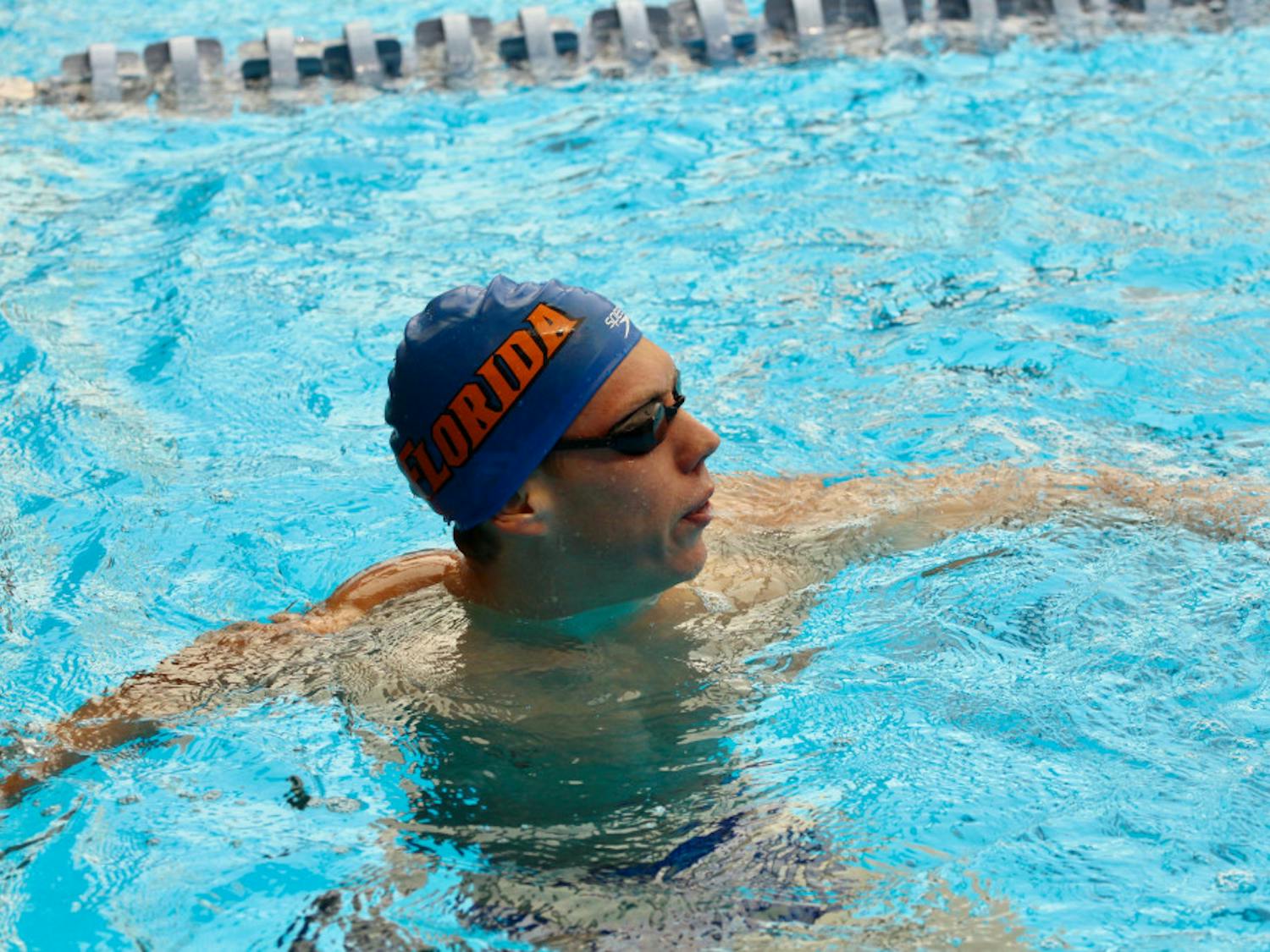 UF swimmer Jan Switkowski won three individual competitions to help the Gators men's swimming and diving team beat Georgia on Friday for the first time since 2013.