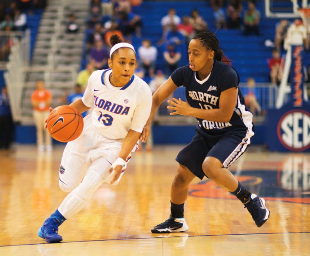 <p align="justify">Cassie Peoples drives down the lane during Florida’s 88-77 win against North Florida on Nov. 10, 2013, in the O’Connell Center.</p>