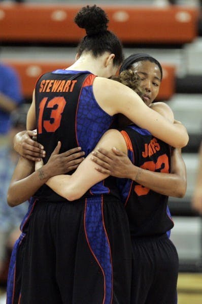 Seniors Azania Stewart, Jordan Jones and Deana Allen embrace following their season-ending NCAA Tournament loss to Baylor on Tuesday.