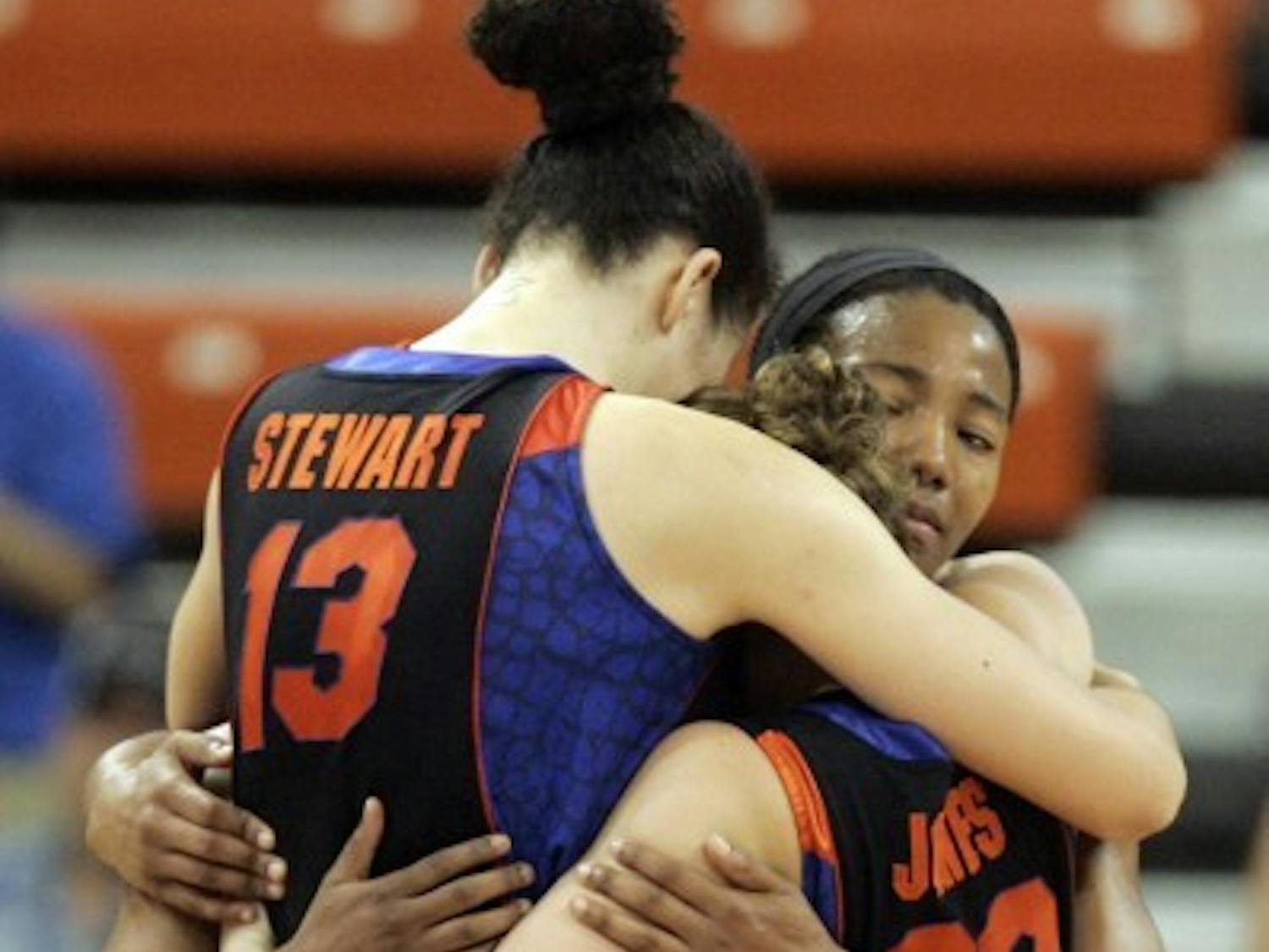 Seniors Azania Stewart, Jordan Jones and Deana Allen embrace following their season-ending NCAA Tournament loss to Baylor on Tuesday.