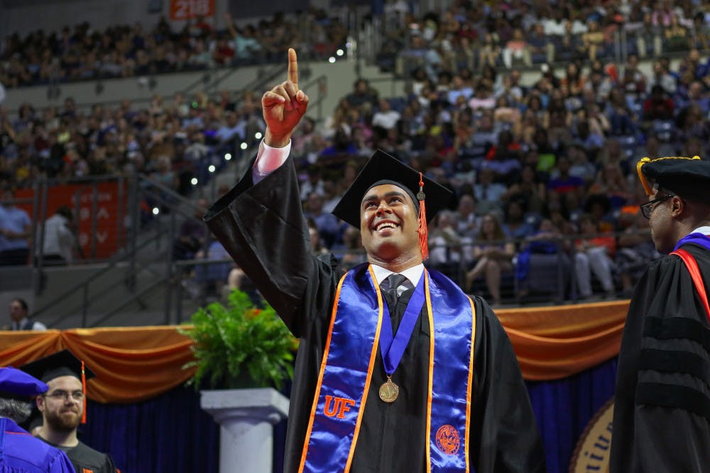 Ali Shahin, a 23-year-old student graduating with a bachelor’s degree in mechanical engineering, walks across the stage Saturday in the O’Connell Center during the Summer 2019 graduation ceremony at the University of Florida. Shahin has accepted a job to work with the Florida Department of Transportation, UF and Gamma Scientific to be lead research engineer for the development of equipment to measure the reflectivity of pavement markings.