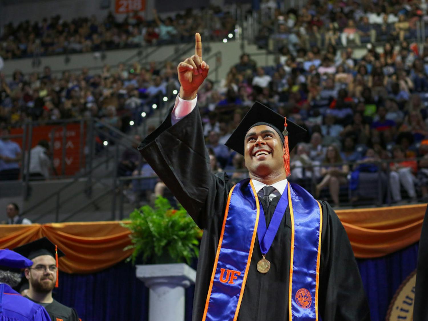 Ali Shahin, a 23-year-old student graduating with a bachelor’s degree in mechanical engineering, walks across the stage Saturday in the O’Connell Center during the Summer 2019 graduation ceremony at the University of Florida. Shahin has accepted a job to work with the Florida Department of Transportation, UF and Gamma Scientific to be lead research engineer for the development of equipment to measure the reflectivity of pavement markings.