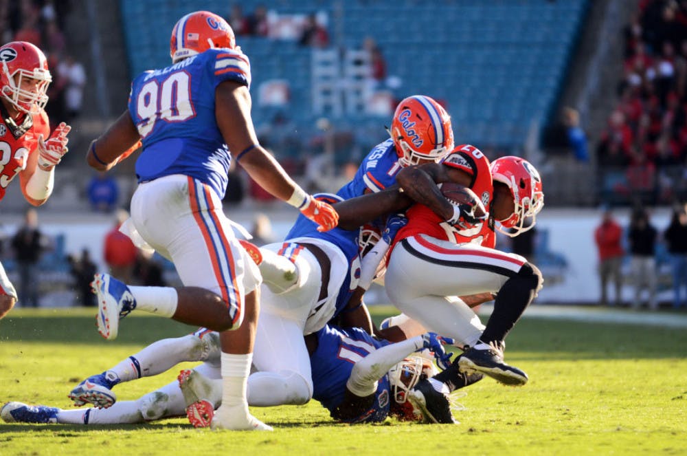 <p>Vernon Hargreaves III makes a tackle during Florida's 38-20 win against Georgia at EverBank Field in Jacksonville.</p>