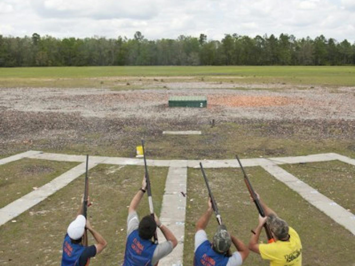 The Florida Gator Trap, Skeet and Sporting Team takes aim at a clay disk filled with orange powder at the Gator Skeet and Trap Club last Tuesday.