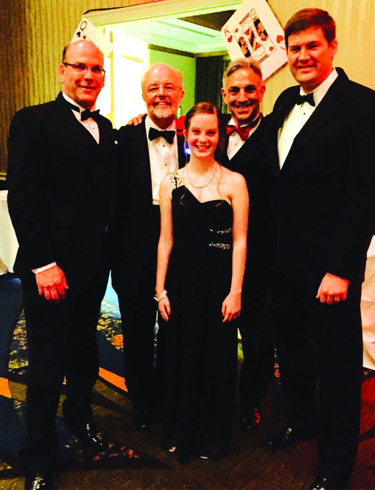 Dr. Biagio Pietra, Dr. Jay Fricker, Dr. Mark Bleiweis and Dr. James Fudge pose with Cristina Cinca, who received a heart transplant from UF Health Shands Hospital in September 2014, at the American Heart Association Heart Ball on Feb. 14, 2016. Bleiweis performed Cinca’s surgery, and Fricker was her cardiologist.