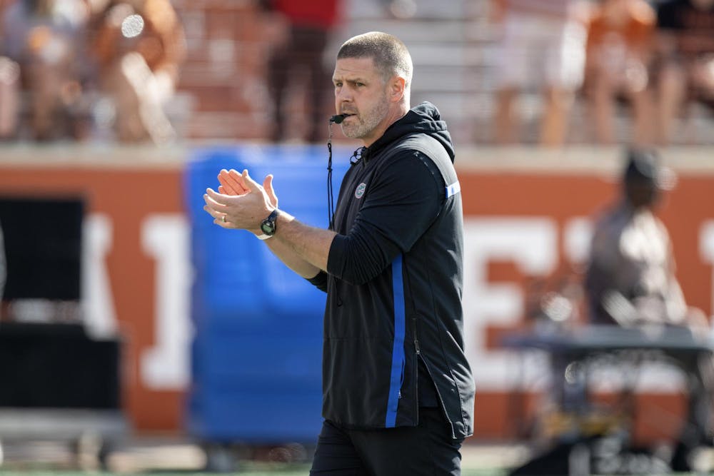 Florida Gators head coach Billy Napier patrols the field during pregame warmups at Darrell K Royal Memorial Stadium on Saturday, November 9, 2024.