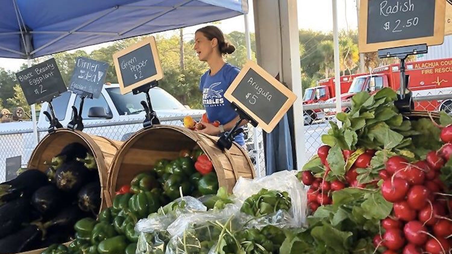The Family Garden sells their produce at the Alachua County Farmers Market on Oct. 26. Now, they’re watching unsold produce rot in their fields due to COVID-19.