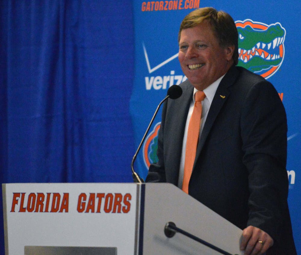 New head football coach Jim McElwain following his introductory press conference on Saturday at Ben Hill Griffin Stadium.