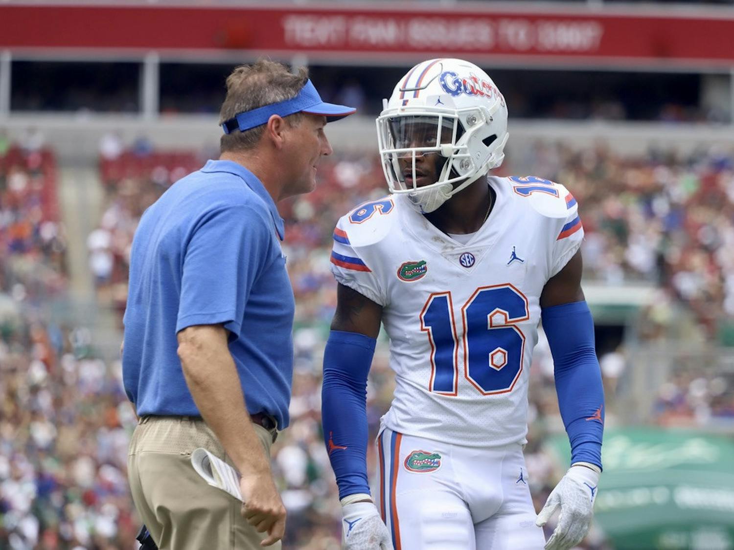 Florida's Tre'Vez Johnson and head coach Dan Mullen talk during their game against South Florida on Sept. 11.