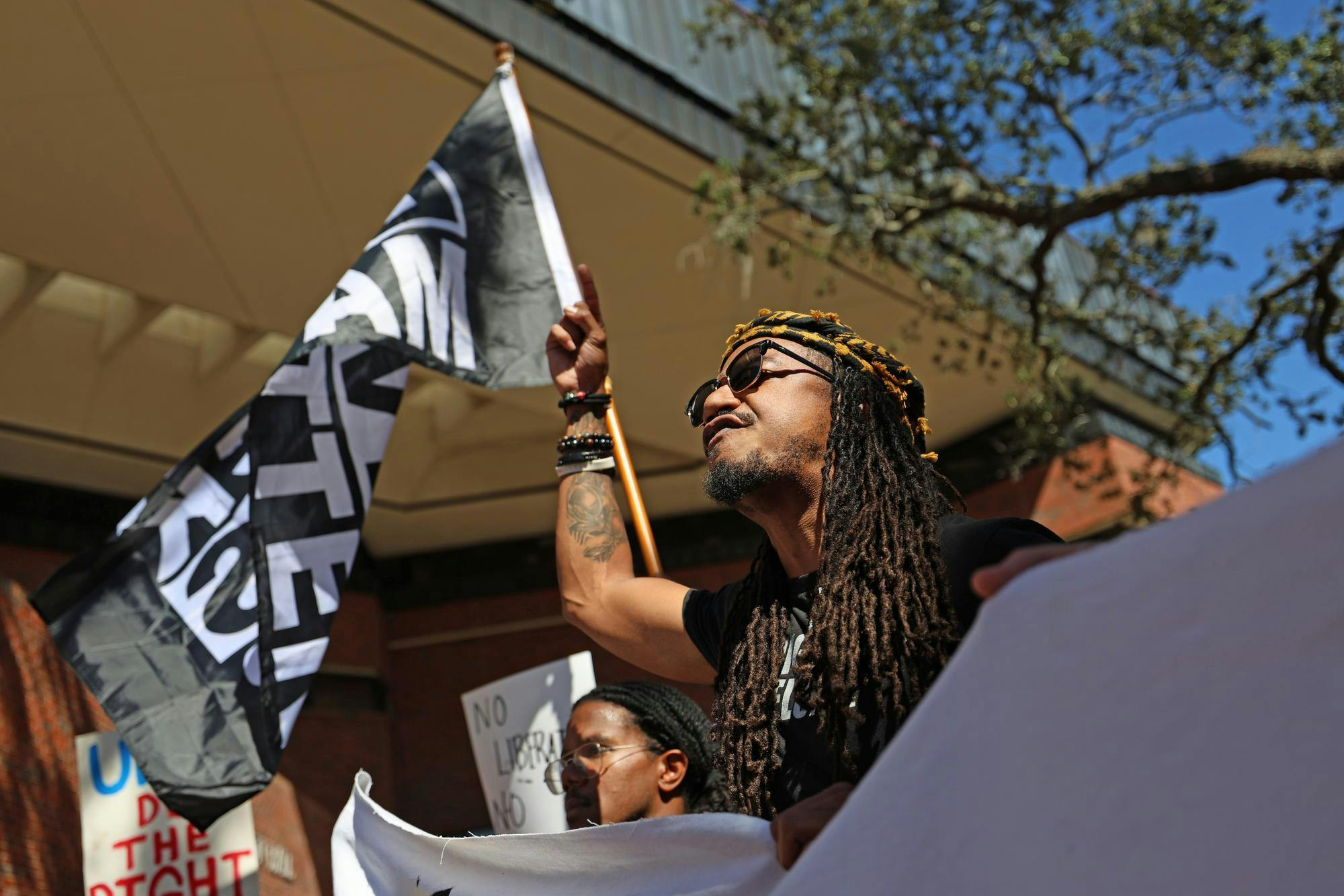 Protestors demonstrate against ICE in Turlington Plaza, Thursday, October. 22, 2026, in Gainesville, Fla. 