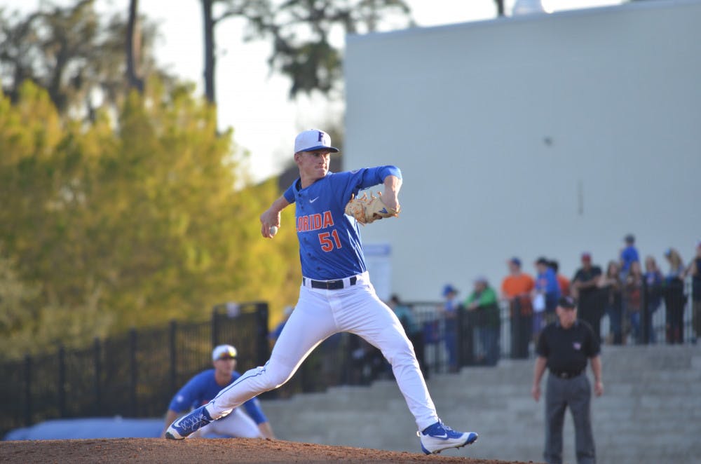 <p>Brady Singer pitches during Florida's 8-4 win against Florida Gulf Coast on Feb. 20, 2016, at McKethan Stadium.</p>