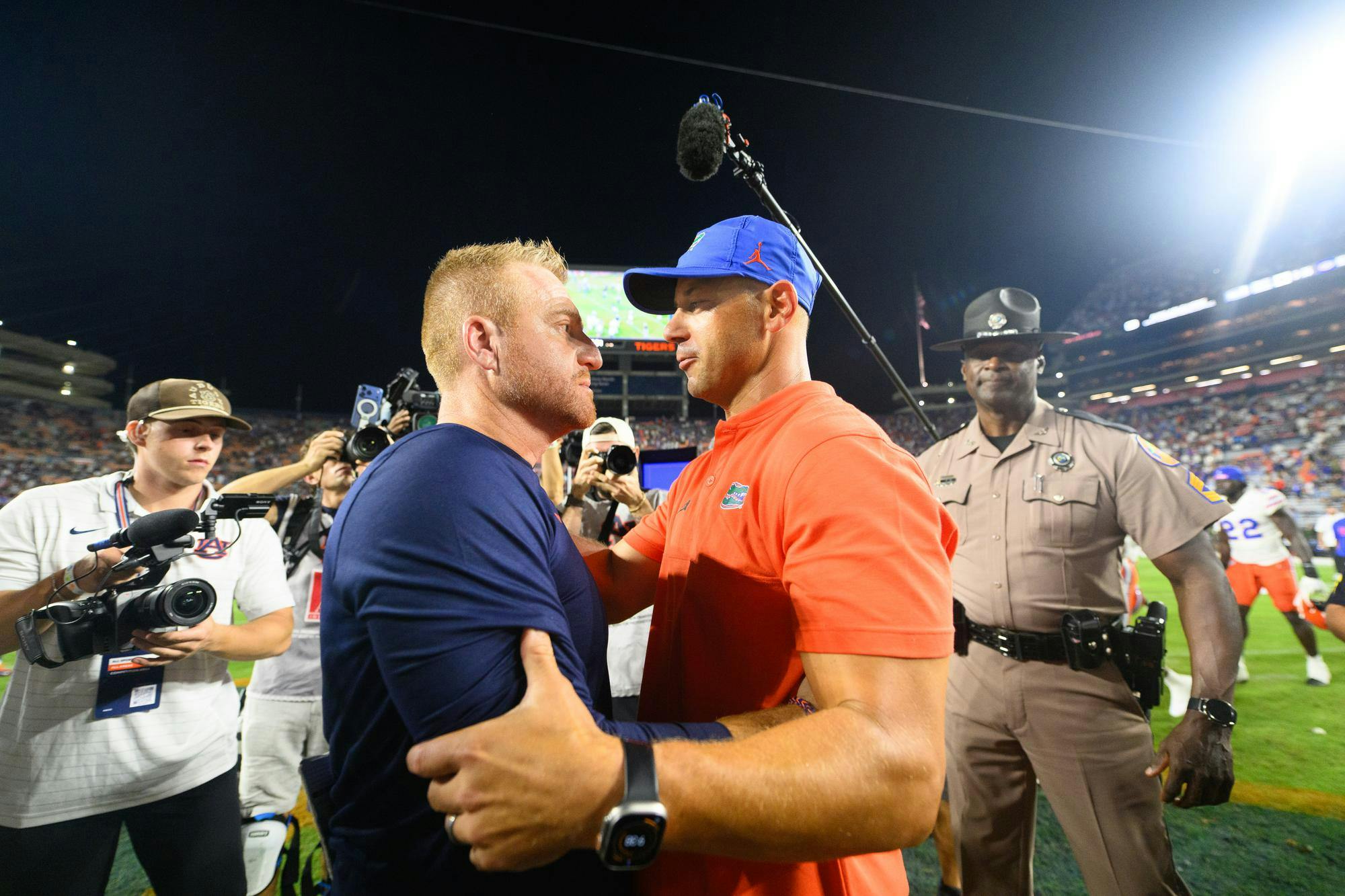 Florida head coach Jon Sumrall shakes hands with Auburn head coach Alex Golesh after winning an NCAA college football game, Saturday, Sept. 19, 2026, in Auburn, Ala.