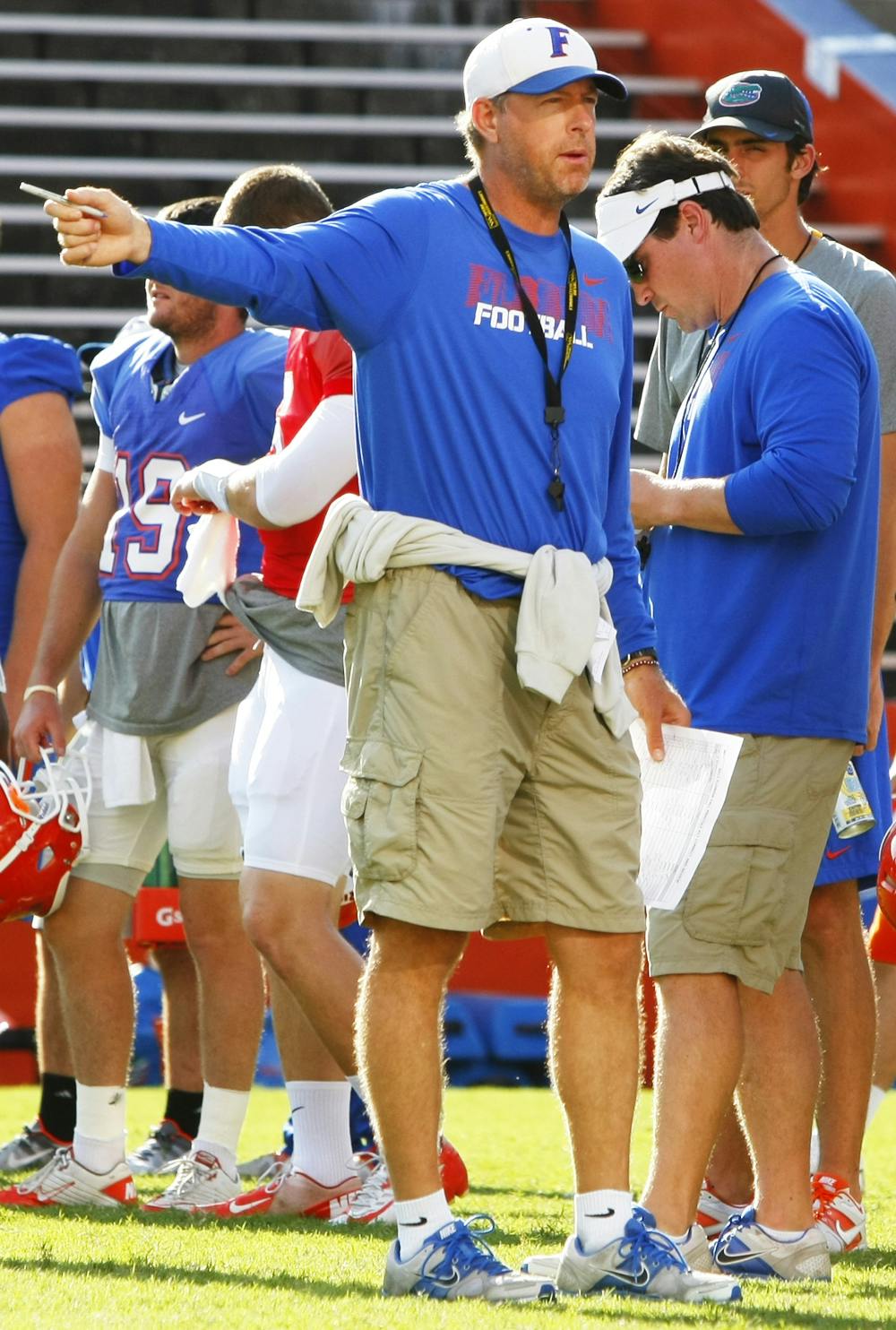 Offensive Coordinator and Quarterbacks Coach Brent Pease, gives instructions during open practice Aug. 18.