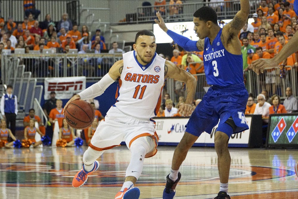 <p>Chris Chiozza dribbles the ball during Florida's 88-79 loss to Kentucky on March 1, 2016, in the O'Connell Center.</p>