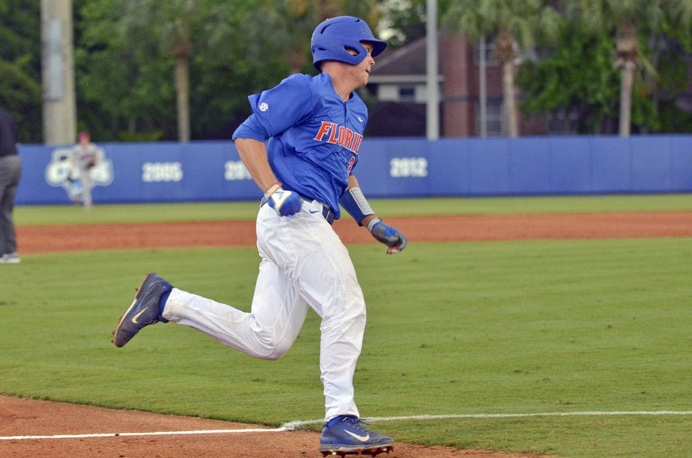UF's JJ Schwarz rounds third base during Florida's 12-5 win against South Carolina on April 11, 2015 at McKethan Stadium.